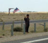 Young Iraqi child greeting the hospital convoy
